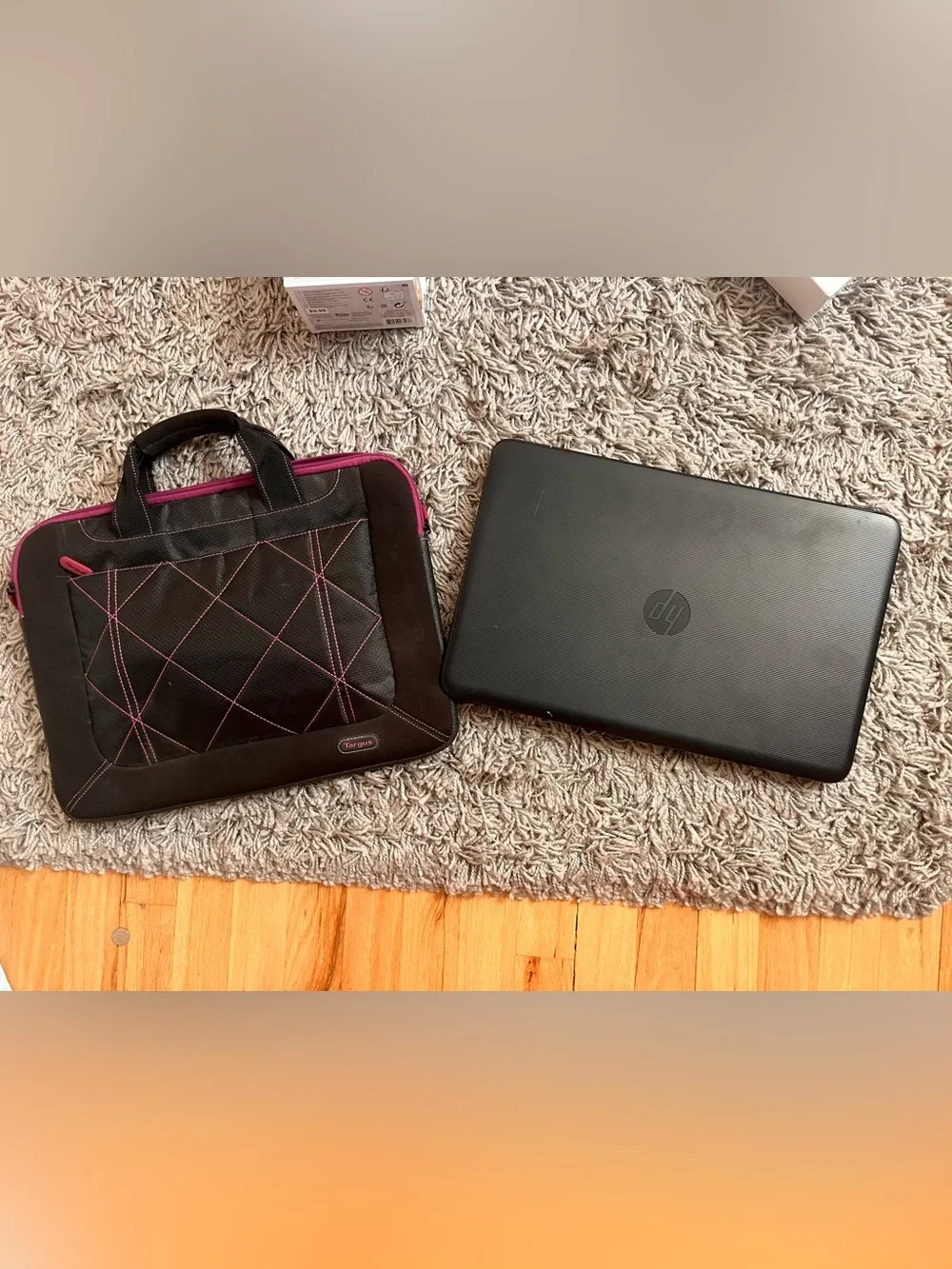 HP Black Laptop with Black Targus Sleeve and Pink Trim